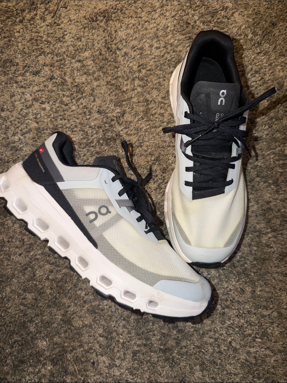 On Running Men's Trail Shoes in White and Black on clouds